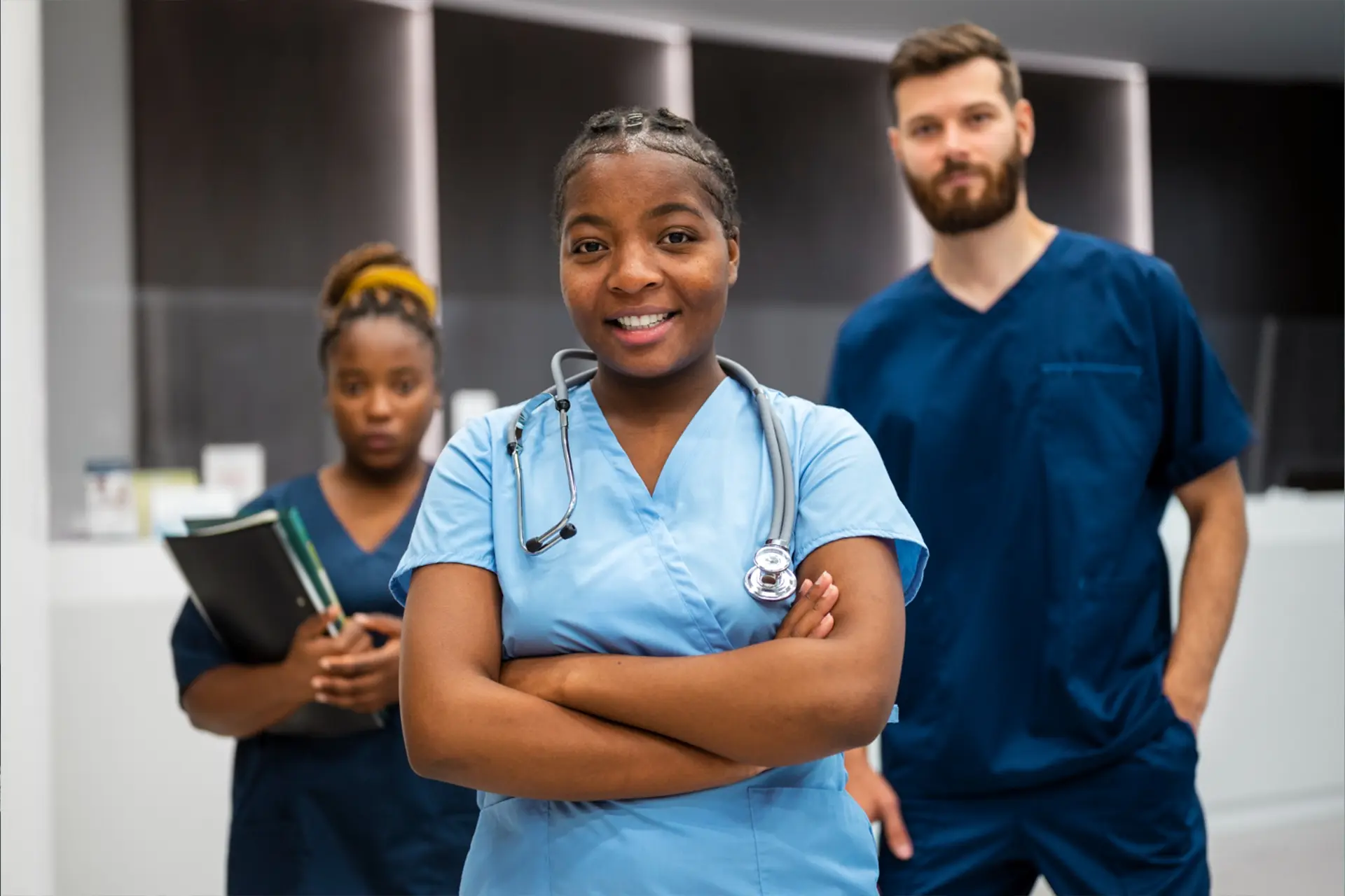 Young UK doctor smiling,ready for new medical career opportunities via a recruitment agency.
